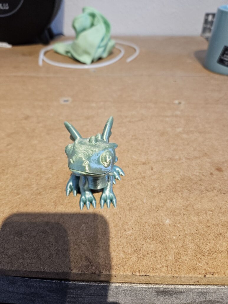 Cute dragon model in rainbow silk filament